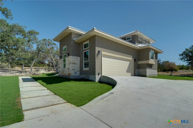 view of side of home with a garage and a yard