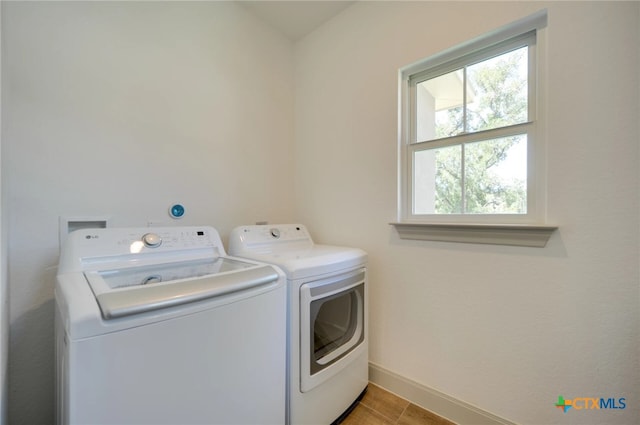 laundry room featuring washing machine and dryer