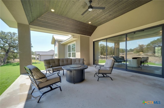 view of patio / terrace featuring an outdoor living space with a fire pit and ceiling fan