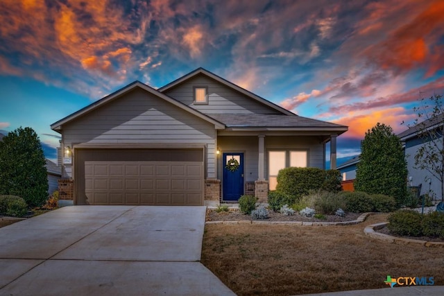 view of front of property with a garage and driveway