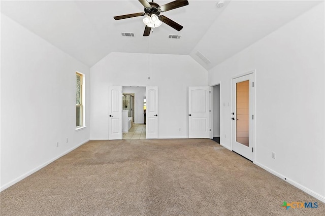 unfurnished bedroom with visible vents, light colored carpet, baseboards, and ceiling fan