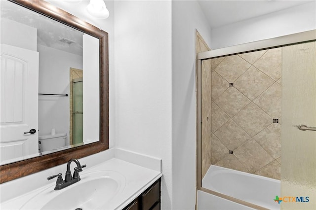 full bathroom featuring toilet, vanity, and shower / bathtub combination