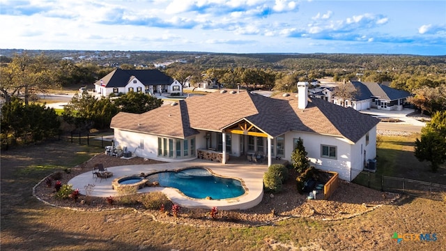 view of pool with an in ground hot tub and a patio