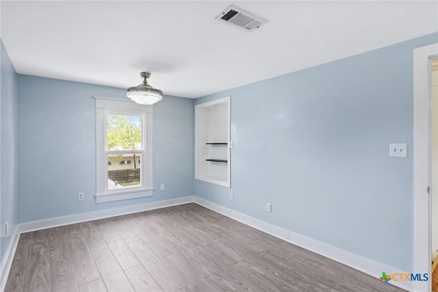 1200 4th St, Palacios, TX 77465 - unfurnished room featuring wood finished floors and baseboards