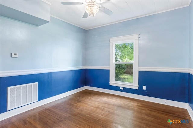 1200 4th St, Palacios, TX 77465 - unfurnished room featuring ornamental molding, wood finished floors, baseboards, and ceiling fan