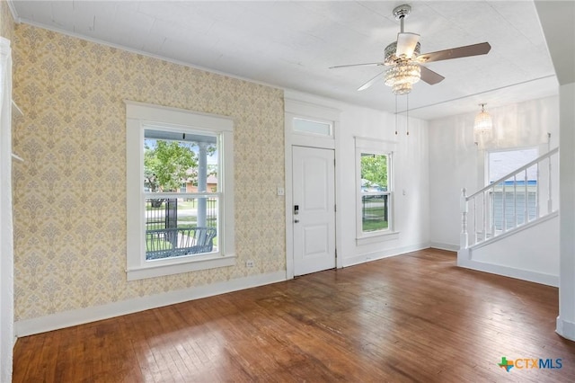 1200 4th St, Palacios, TX 77465 - entryway featuring hardwood / wood-style flooring, healthy amount of natural light, baseboards, stairs, and wallpapered walls