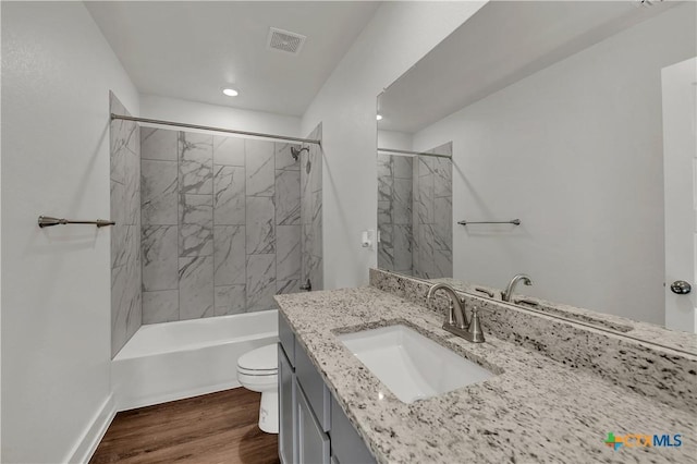2310 Healy Dr, Temple, TX 76502 - full bath with toilet, wood finished floors, vanity, visible vents, and recessed lighting
