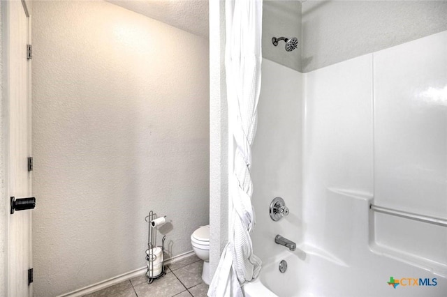 bathroom with toilet, shower / bathtub combination with curtain, and tile patterned floors