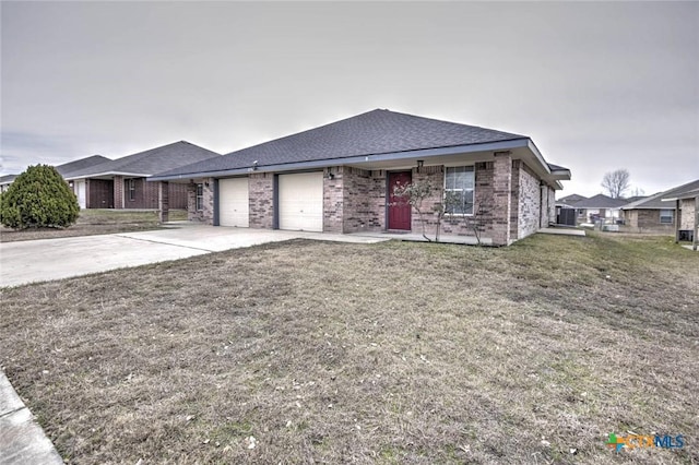 view of front facade with a front yard and a garage