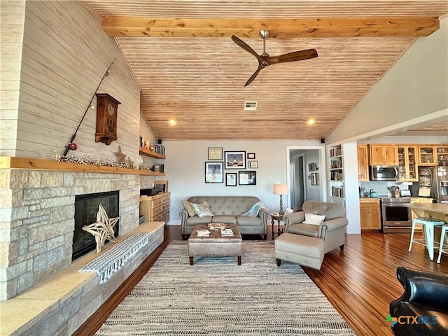 living room with a stone fireplace, hardwood / wood-style floors, high vaulted ceiling, ceiling fan, and wood ceiling