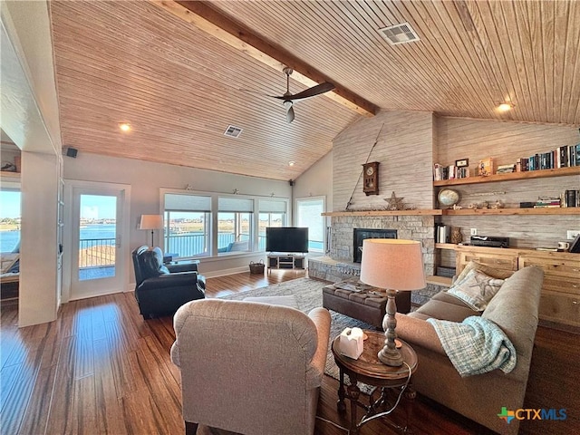 living room featuring wood ceiling, a fireplace, beam ceiling, and dark wood-type flooring