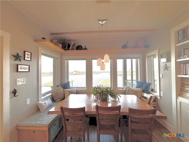 dining area featuring a water view