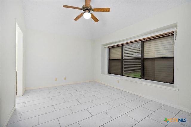 2991 Lakeview E Dr, Ingleside, TX 78362 - spare room with vaulted ceiling, a ceiling fan, and baseboards