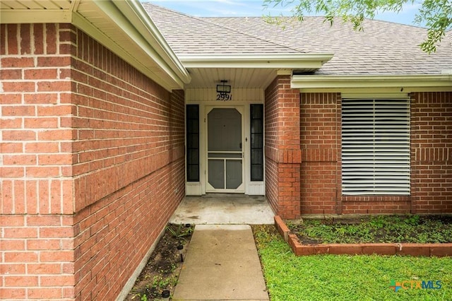 2991 Lakeview E Dr, Ingleside, TX 78362 - property entrance with roof with shingles and brick siding