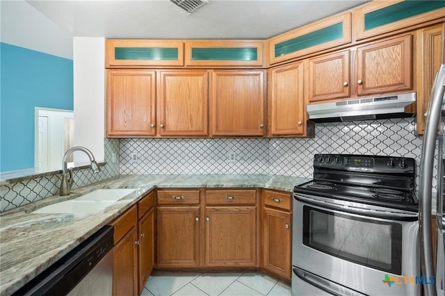 2991 Lakeview E Dr, Ingleside, TX 78362 - kitchen featuring appliances with stainless steel finishes, a sink, under cabinet range hood, light stone countertops, and tasteful backsplash