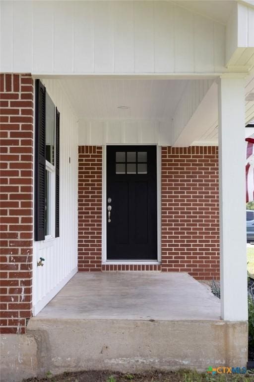 801 E Morgan Ave, Cuero, TX 77954 - property entrance with brick siding and covered porch