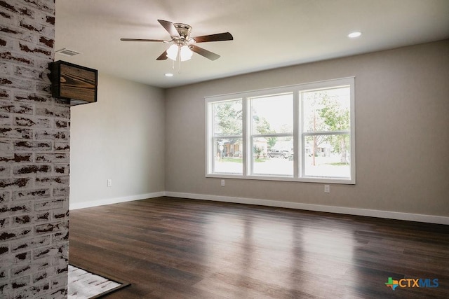 801 E Morgan Ave, Cuero, TX 77954 - spare room featuring wood finished floors, ceiling fan, baseboards, and recessed lighting