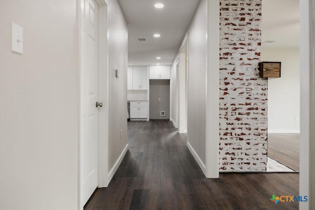 801 E Morgan Ave, Cuero, TX 77954 - hallway featuring dark wood-style flooring, baseboards, and recessed lighting