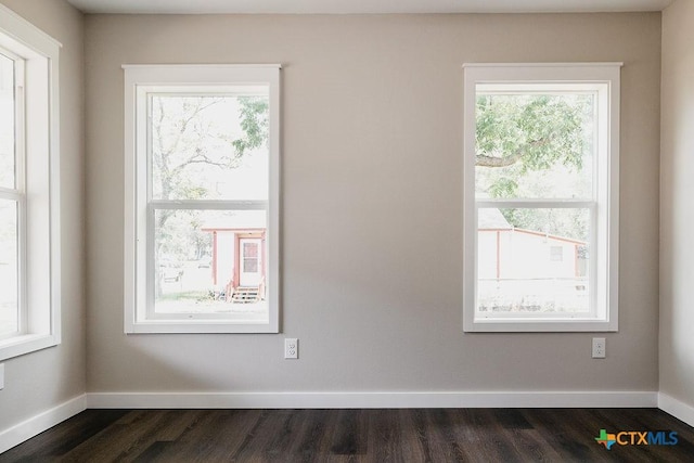 801 E Morgan Ave, Cuero, TX 77954 - unfurnished room featuring dark wood-style floors and baseboards