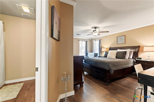 bedroom with baseboards, visible vents, ornamental molding, and dark wood-style flooring