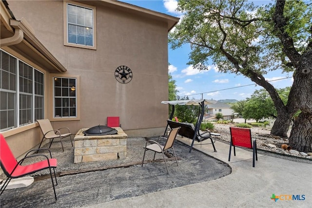 view of patio / terrace featuring a fire pit