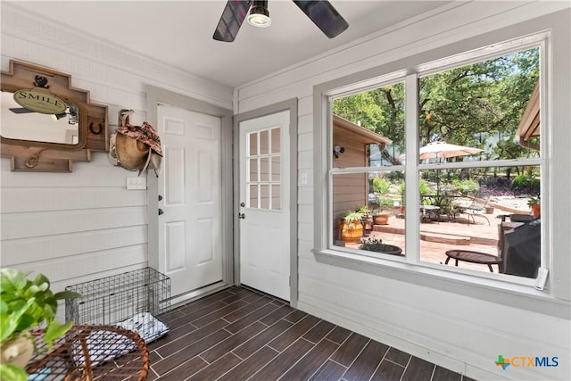 entryway with wood finish floors and a ceiling fan