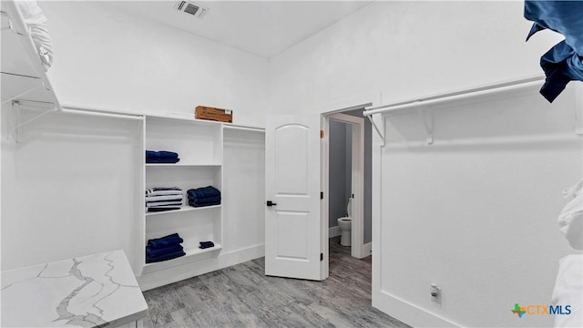 spacious closet with visible vents and wood finished floors