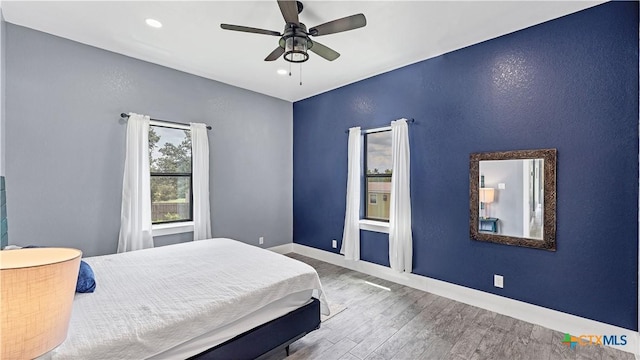 bedroom with recessed lighting, baseboards, a ceiling fan, and wood finished floors