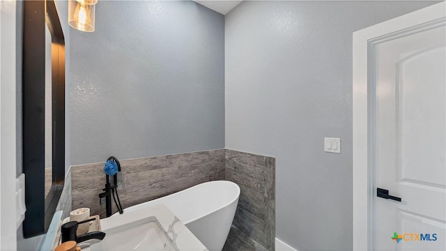 bathroom with a soaking tub