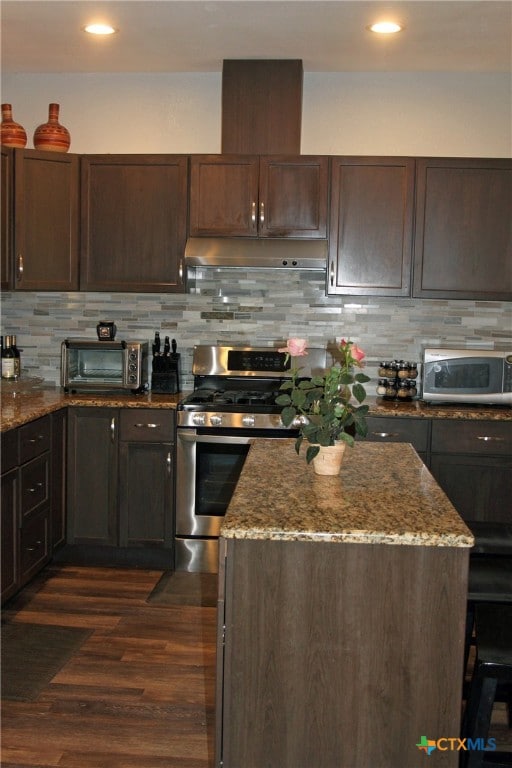 kitchen featuring dark hardwood / wood-style flooring, dark brown cabinetry, and stainless steel appliances