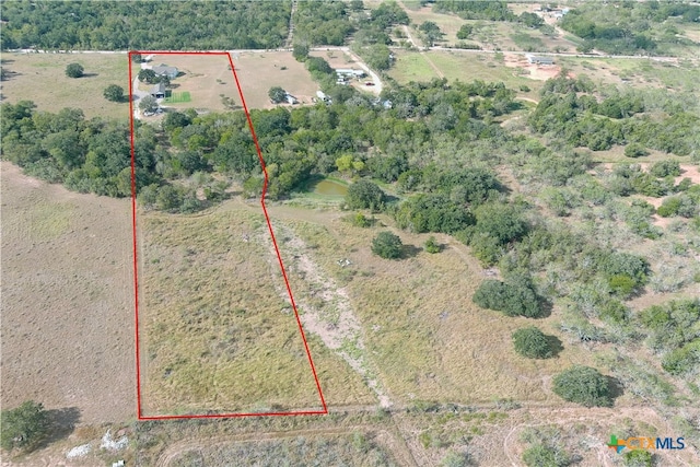 birds eye view of property featuring a rural view