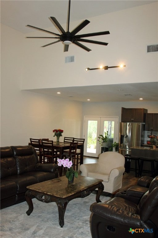 living room with french doors and ceiling fan