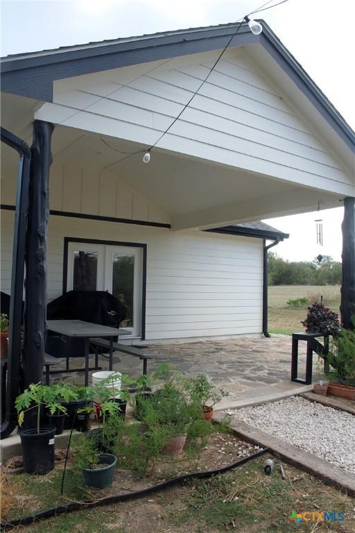 2805 Tumbleweed Trl, Dale, TX 78616 - rear view of house featuring french doors and a patio
