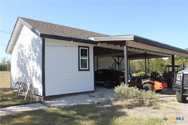 exterior space with a carport