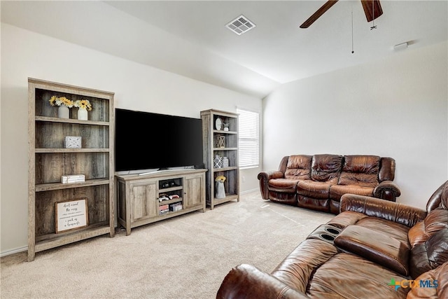 living room featuring vaulted ceiling, light colored carpet, and ceiling fan