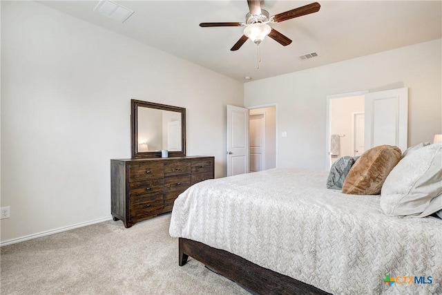 carpeted bedroom with ceiling fan and connected bathroom