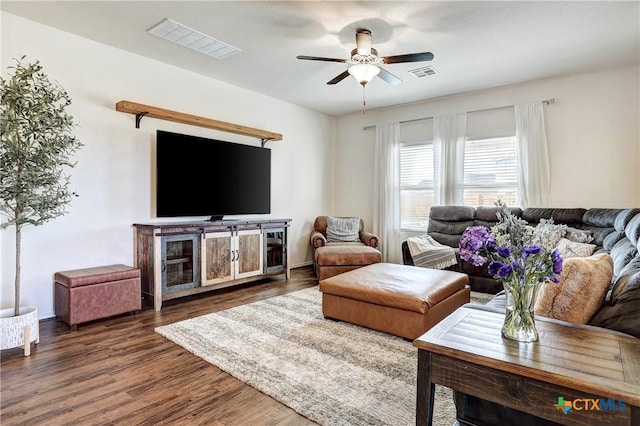 living room with dark hardwood / wood-style floors and ceiling fan