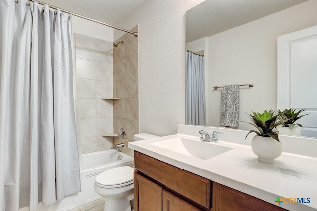 full bathroom featuring toilet, vanity, and shower / bathtub combination with curtain