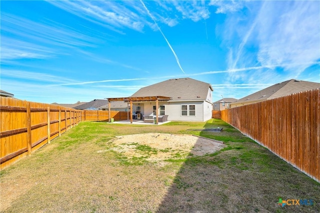 back of property with a yard and a patio area