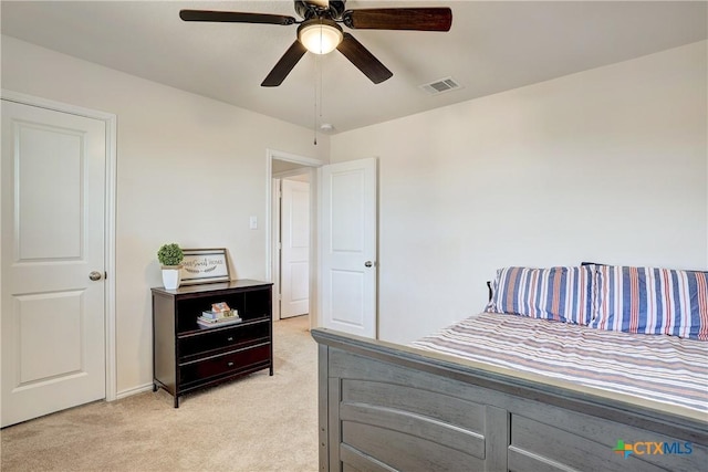 bedroom featuring light carpet and ceiling fan