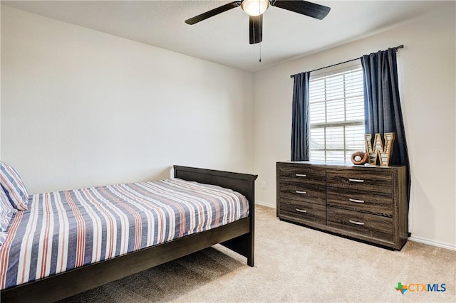 carpeted bedroom with ceiling fan