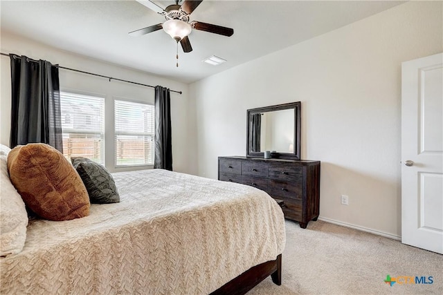 bedroom with light colored carpet and ceiling fan