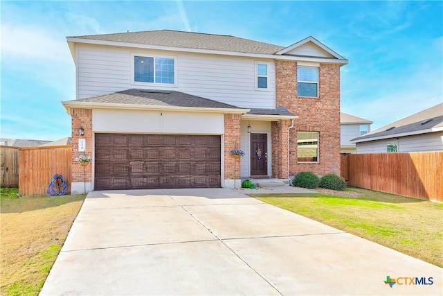 view of front property with a garage and a front yard