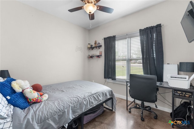 bedroom with ceiling fan, carpet flooring, and baseboards