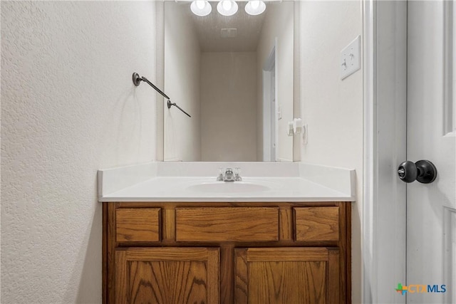 125 Big Timber Dr, Temple, TX 76502 - bathroom with a textured wall and vanity