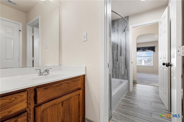 125 Big Timber Dr, Temple, TX 76502 - bathroom featuring vanity, bathtub / shower combination, and wood finished floors