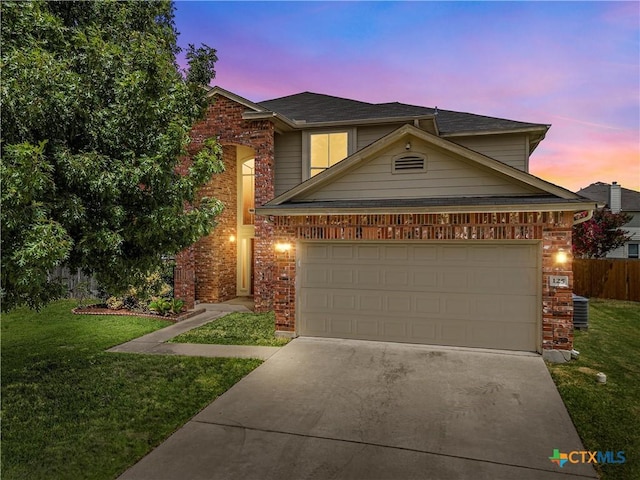 125 Big Timber Dr, Temple, TX 76502 - traditional-style home featuring concrete driveway, brick siding, and a garage