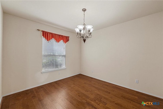 125 Big Timber Dr, Temple, TX 76502 - spare room featuring a chandelier and hardwood / wood-style floors