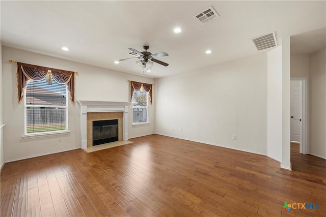 125 Big Timber Dr, Temple, TX 76502 - unfurnished living room with ceiling fan, a fireplace, recessed lighting, and wood finished floors