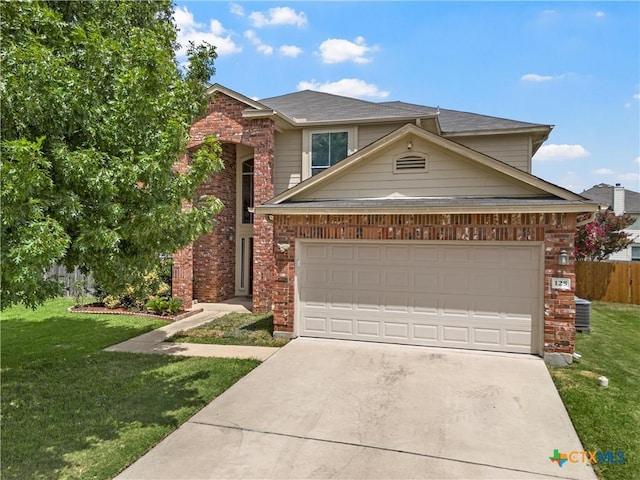 125 Big Timber Dr, Temple, TX 76502 - traditional-style house with driveway, brick siding, and a garage